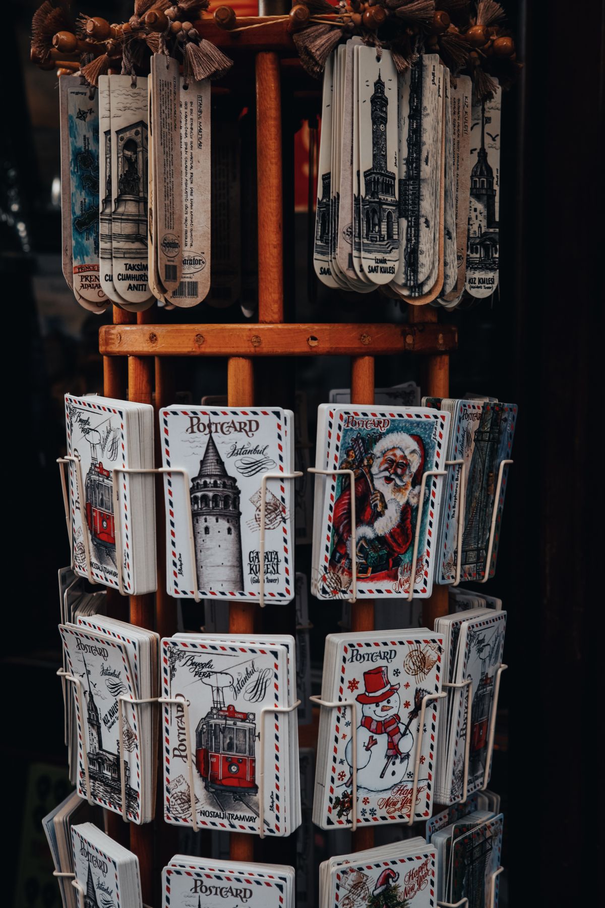 Postcards and small souvenirs displayed in a gift shop