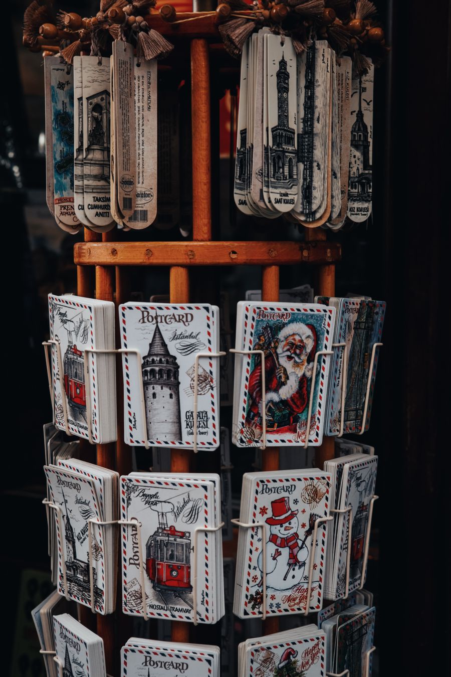 A carousel stand holding cards and small gifts in a shop