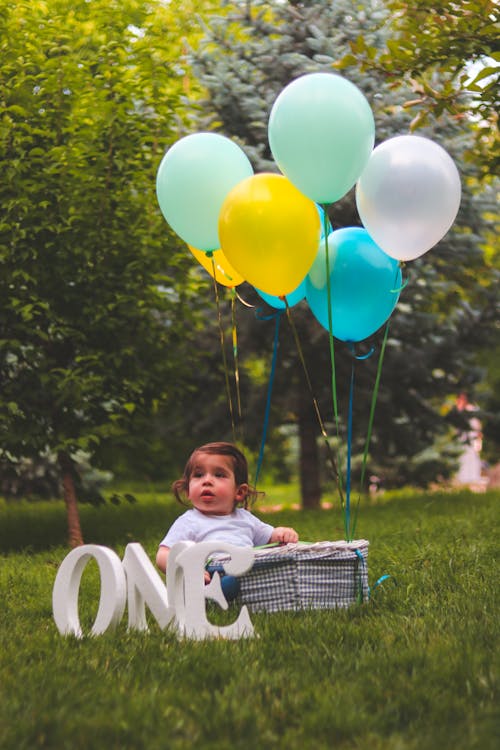 Girl and Assorted Color Balloons