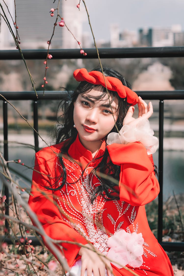 A Woman In Red Long Sleeve Dress