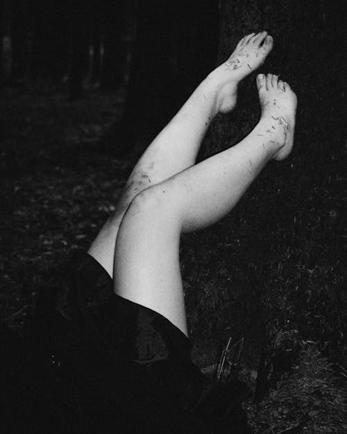A Grayscale of the Legs of a Woman