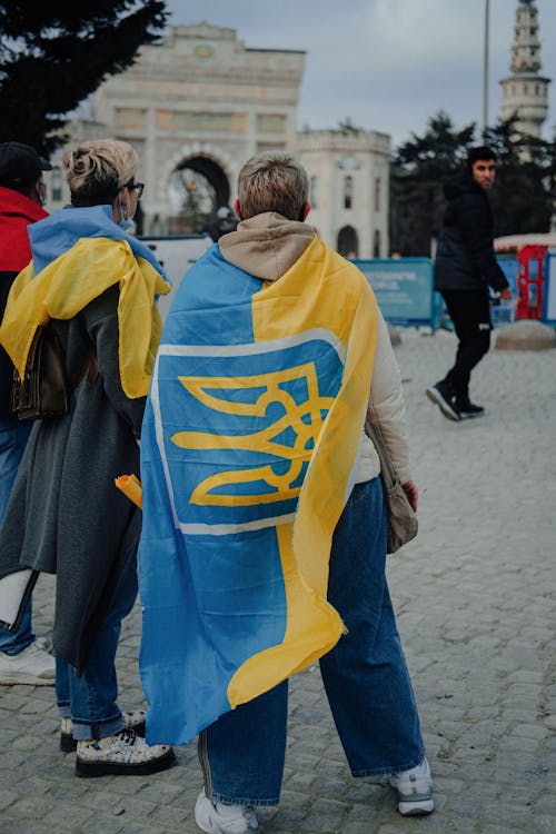 Free A Person Wrapped in the National Flag of Ukraine Stock Photo