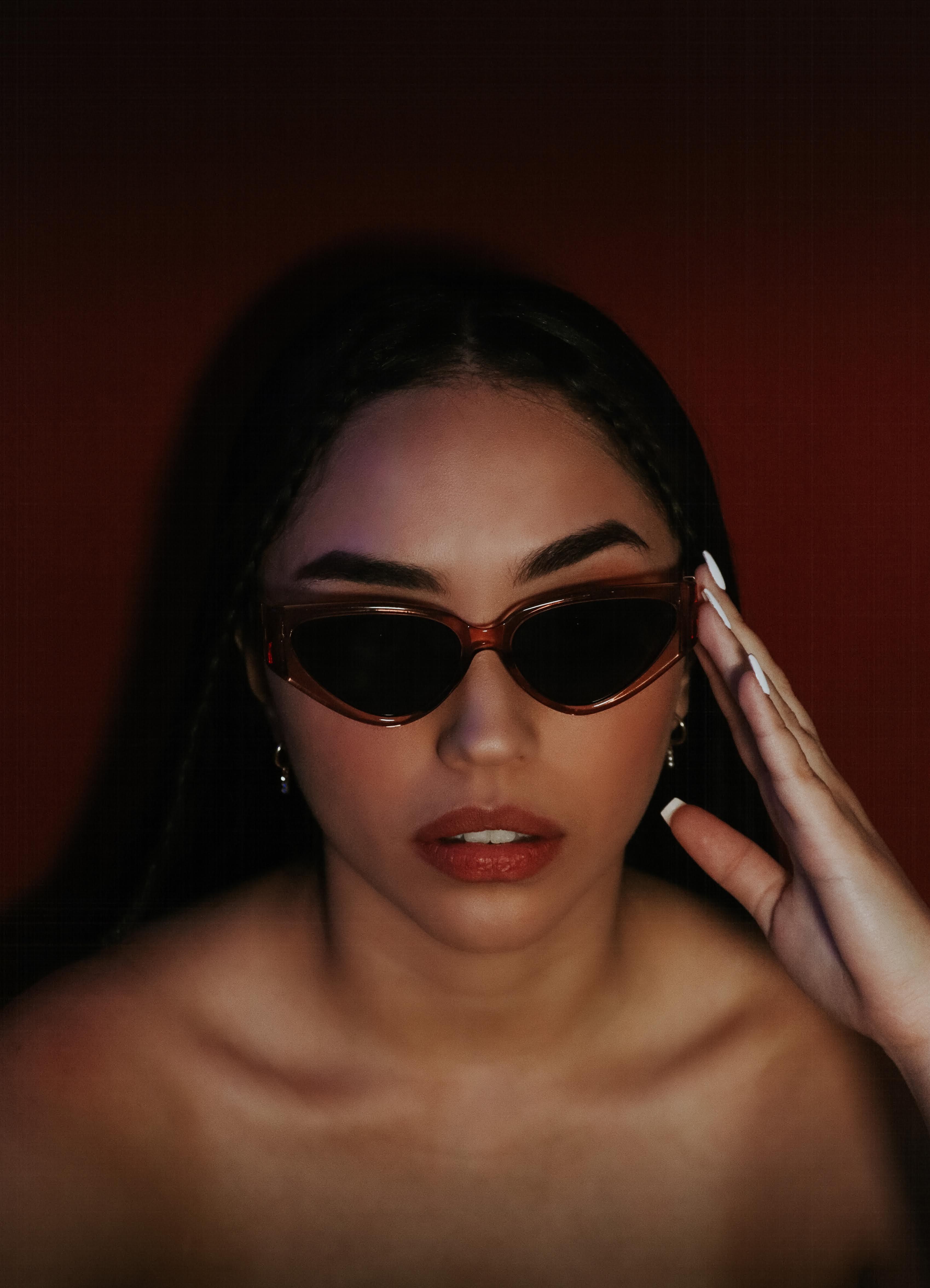 A Woman Wearing Black Sunglasses · Free Stock Photo