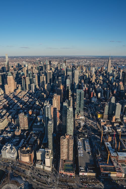 An Aerial Photography of City Buildings Under the Blue Sky