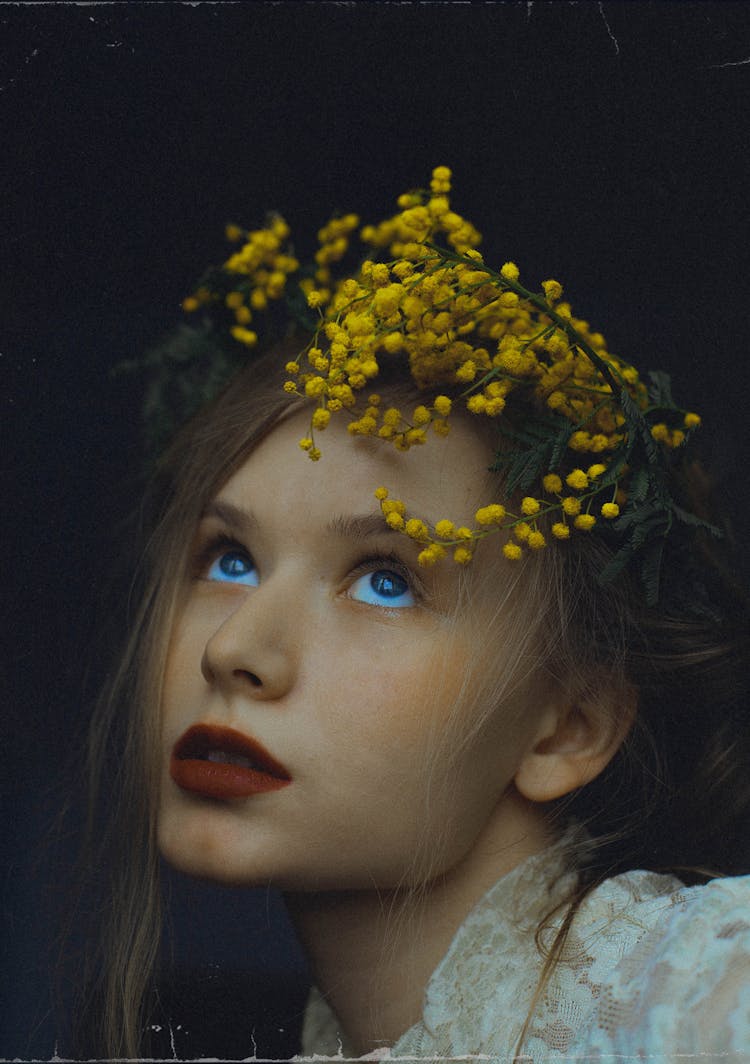 
A Woman With A Mimosa Plant On Her Head