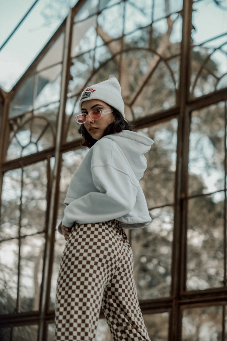 A Woman Wearing Cropped Hoodie And Sunglasses