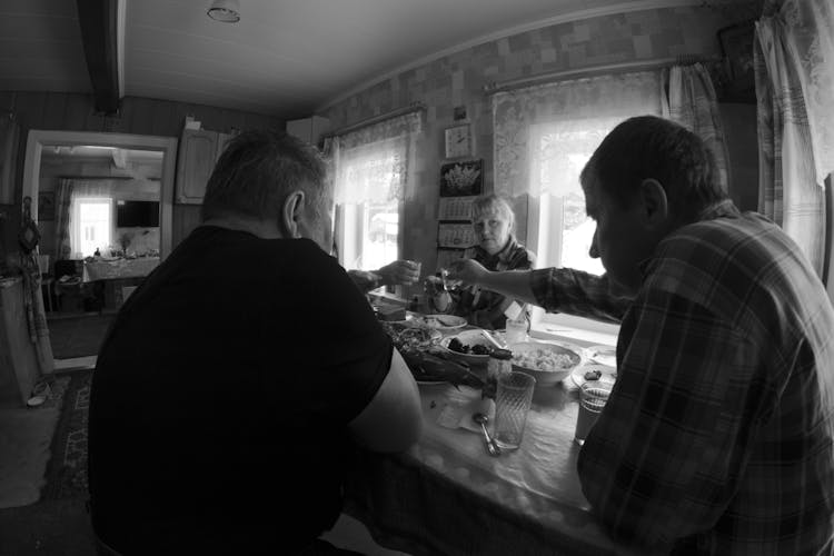 Grayscale Photo Of Adult People Toasting 