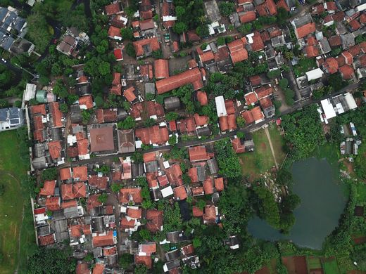 Top down aerial view of residential rooftops