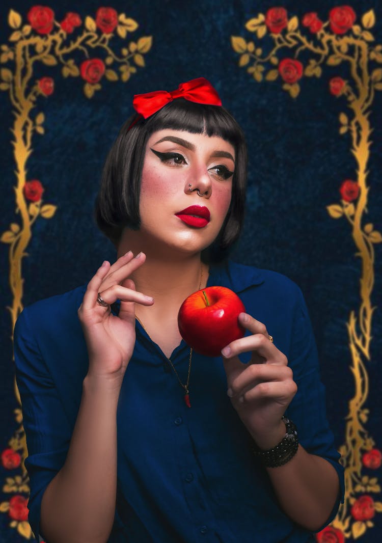 A Woman Holding Red Apple