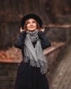 Woman in Black Long Sleeve Dress and Gray Scarf