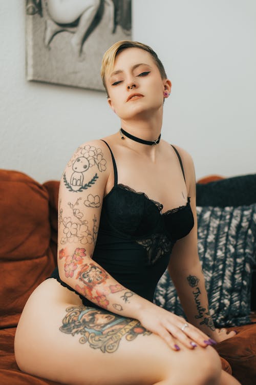 Sexy Woman with Tattoos Posing in Lingerie