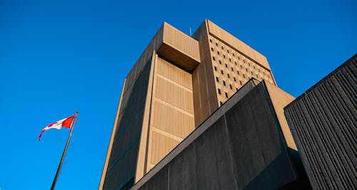 Free Brown Concrete Building Under the Blue Sky Stock Photo