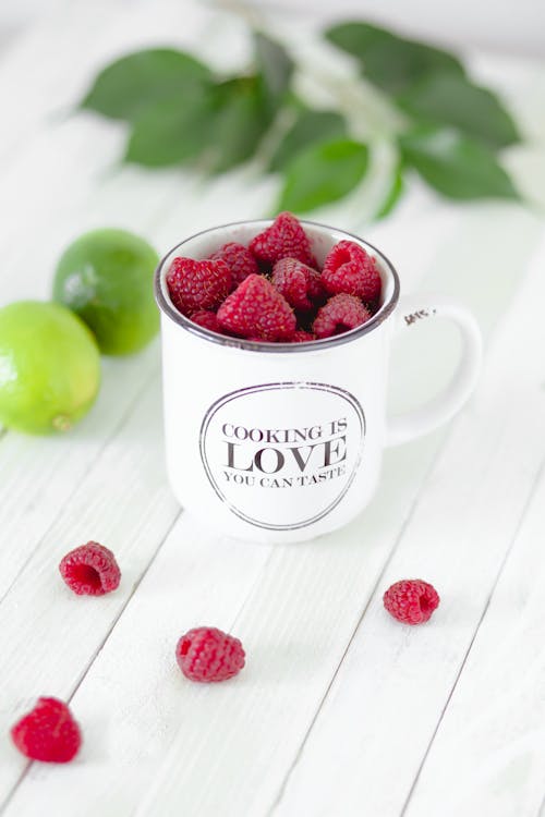 Close-Up Photography of Raspberries on Cup
