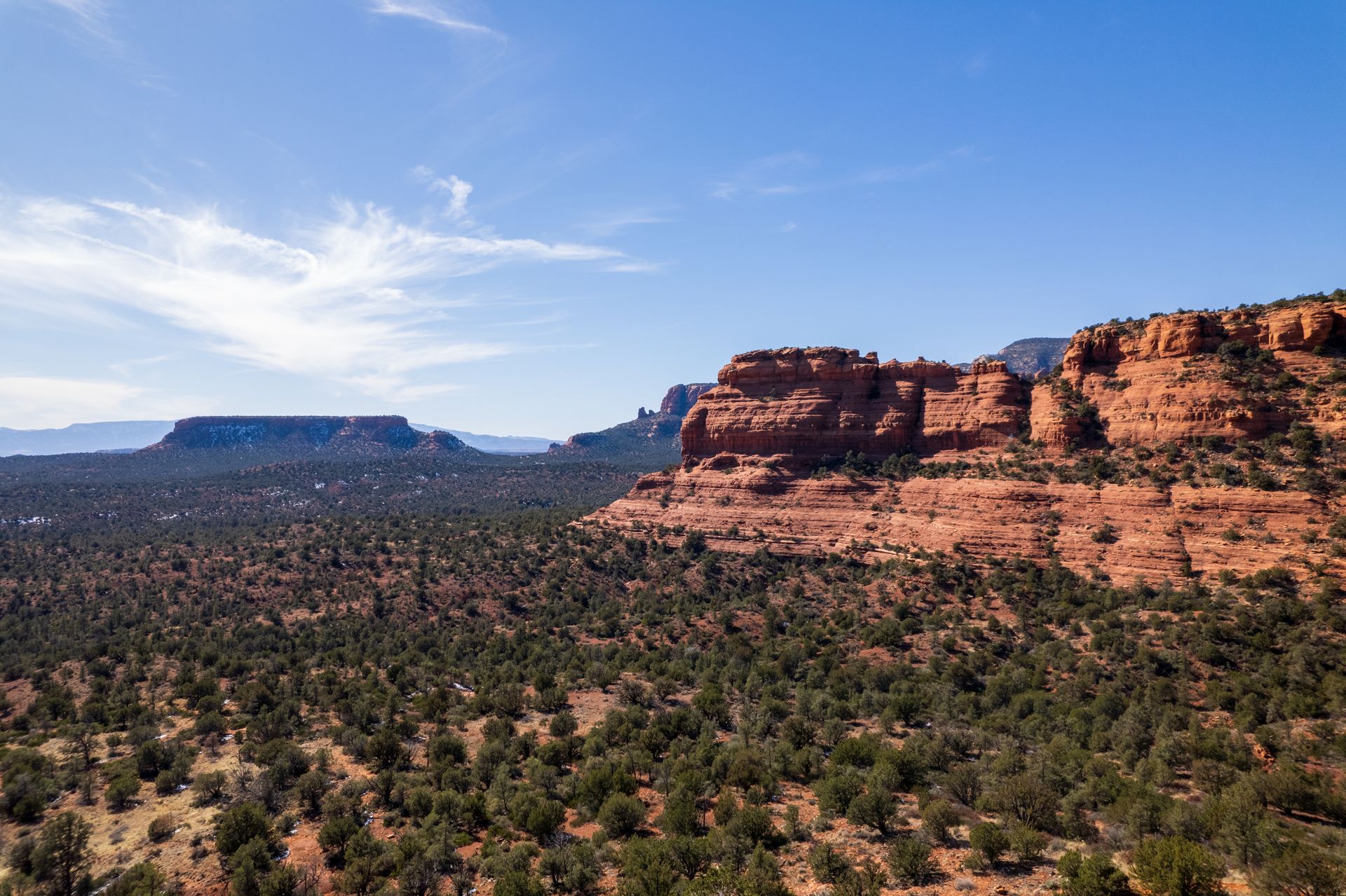 Explore the stunning red rock formations of Sedona under a clear blue sky.