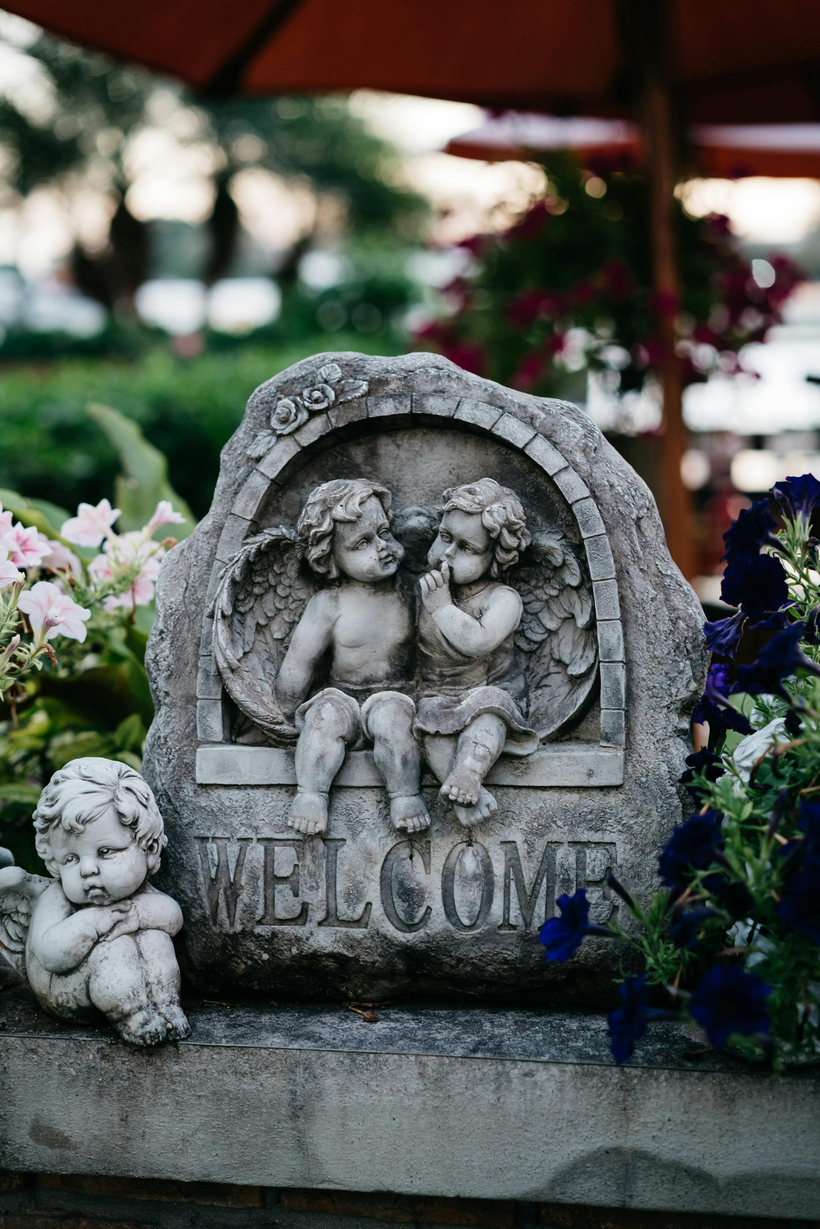 A Gray Concrete Angel Statue · Free Stock Photo