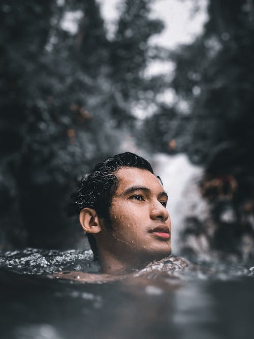 Man in Water in Close Up Photography