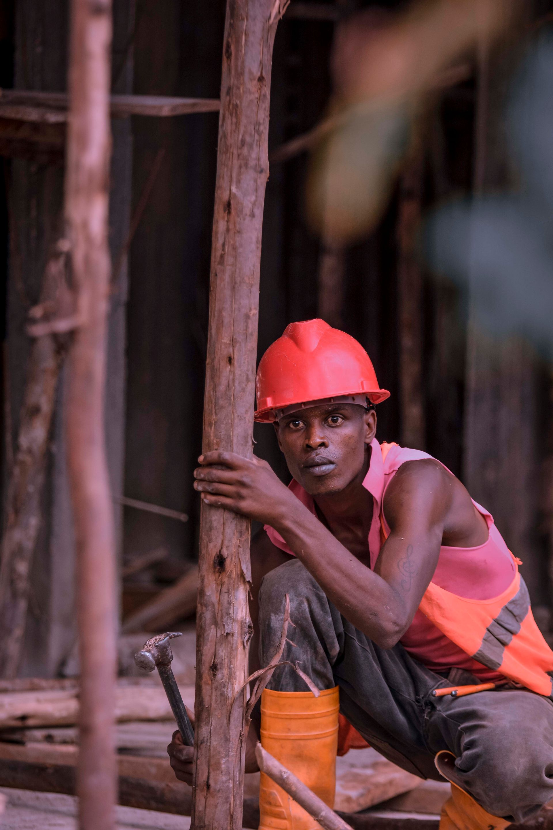 Safety officer in helmet and protective gear on a site in East Africa