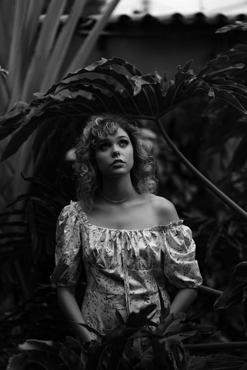 Woman Looking up among Plants