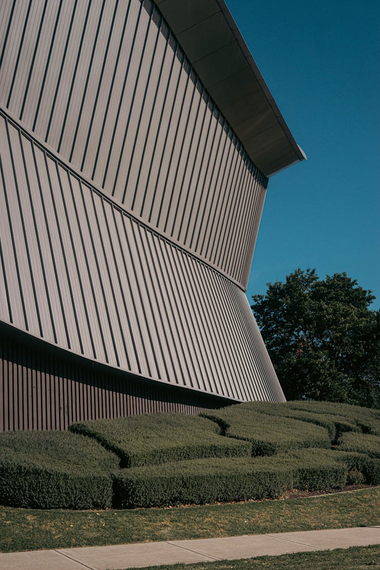 Modern Geometric Building In Green Garden