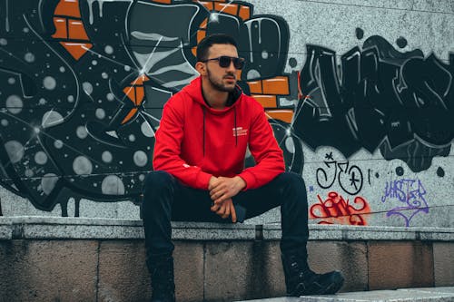 Free Man Wearing Red Hoodie and Sunglasses Stock Photo