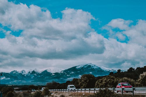 Vehicles Passing By Mountain