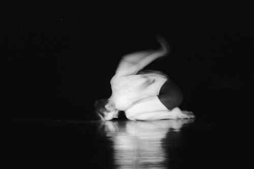 Free A dynamic black and white photo capturing a dancer in motion on the floor. Stock Photo