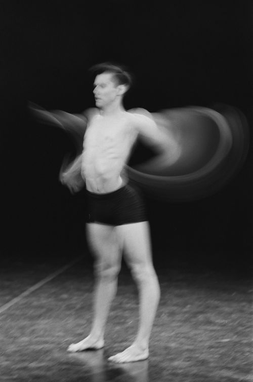 Free Blurred motion capture of a topless male dancer in black shorts, emphasizing movement. Stock Photo