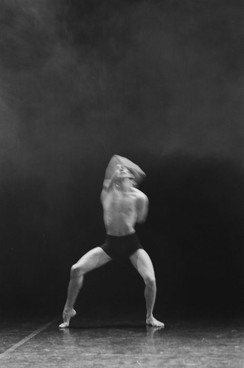 Free A powerful black and white image of a shirtless ballet dancer mid-performance, showcasing motion and artistry. Stock Photo