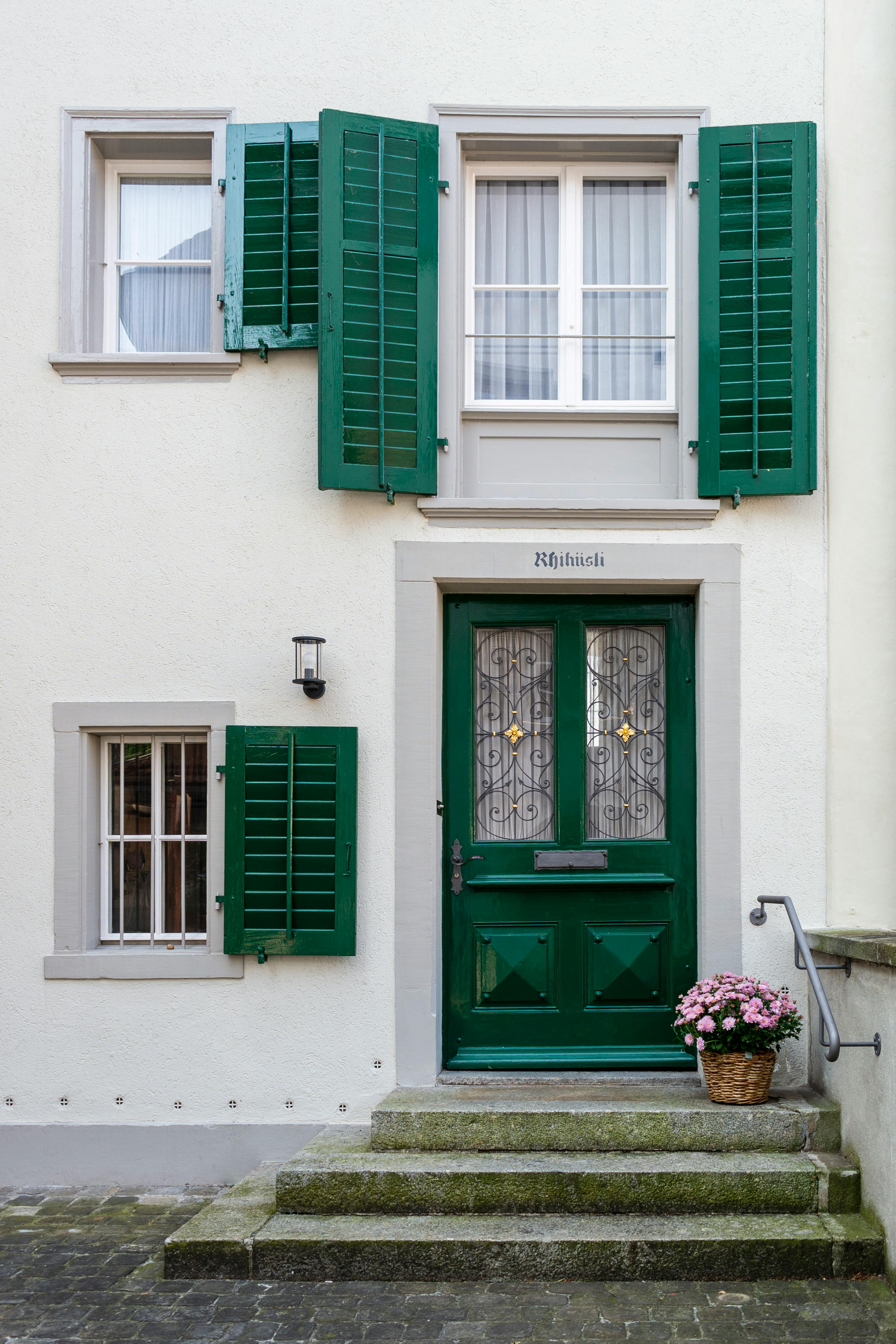 Classic green shutters and door in historic Stein am Rhein, Switzerland.