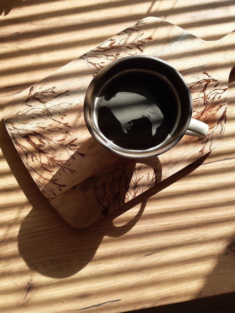 Coffee Cup On Tray In Sunlight