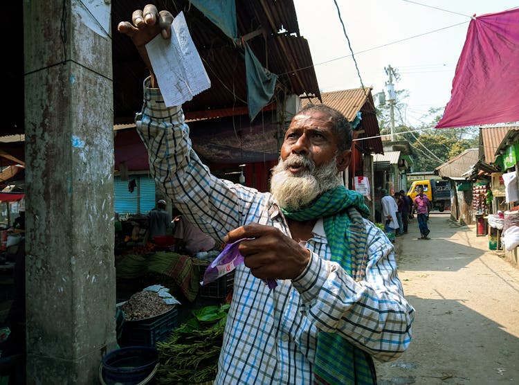 Old Bearded Man On Market 