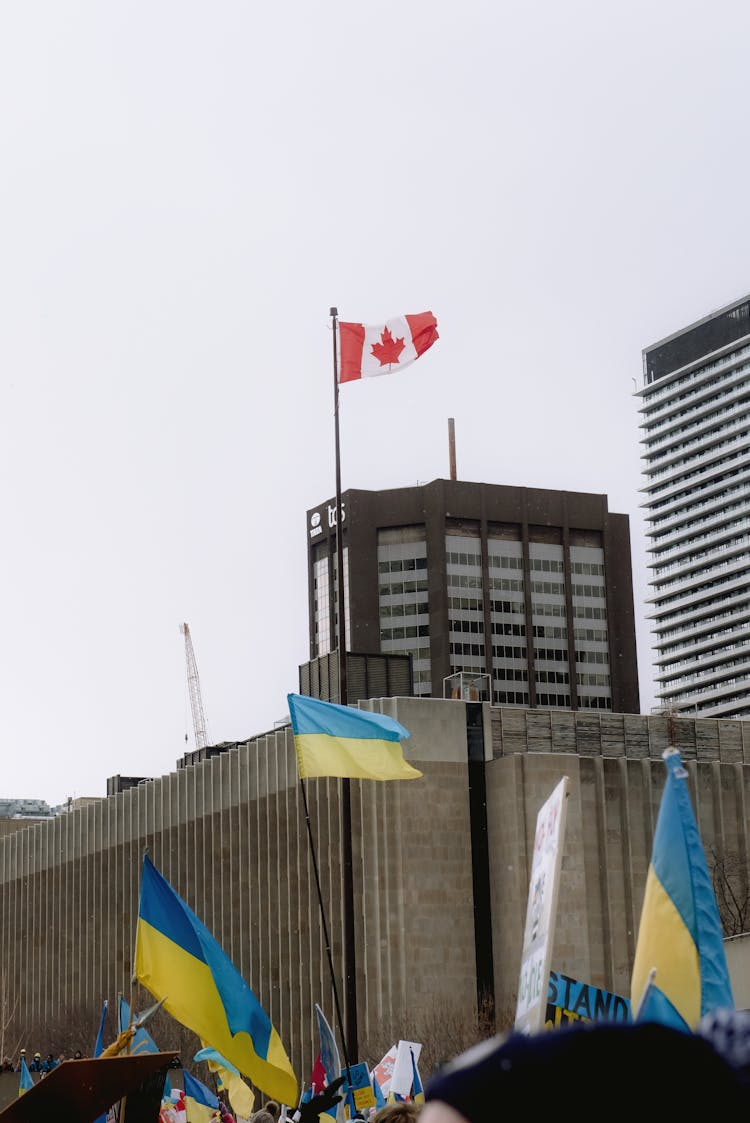 Canadian And Ukrainian Flags In A City