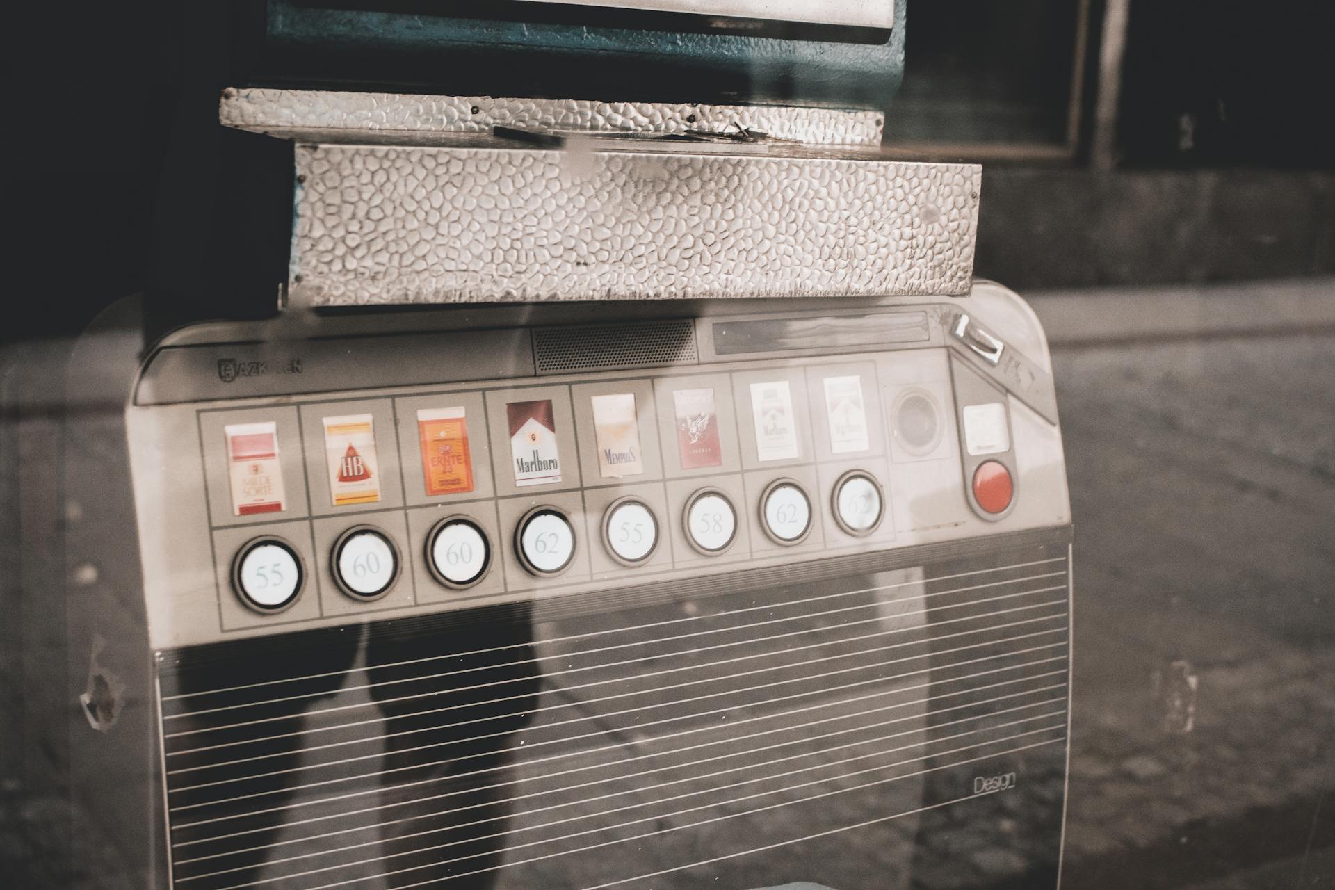 Retro cigarette vending machine on a street, reflecting urban nostalgia and vintage style.