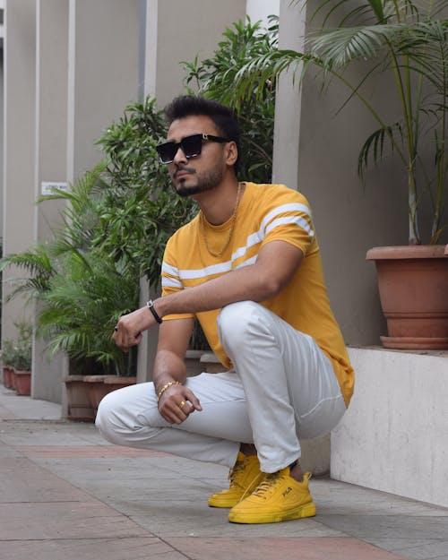 A Man Wearing Yellow Shirt and Yellow Shoes