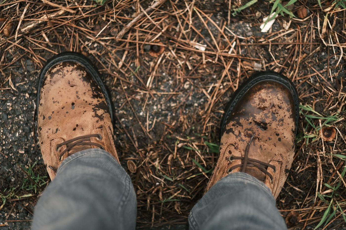 Worn brown leather boots, overhead view