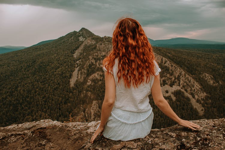 A Woman On Top Of The Mountain