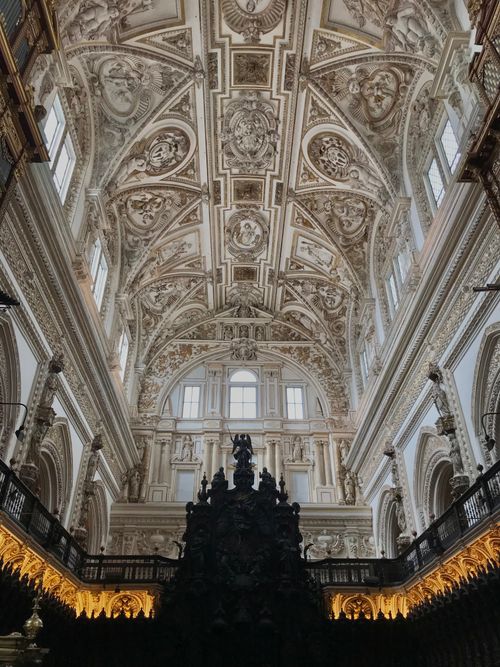 Free Explore the stunning architectural design of the intricate ceilings inside Córdoba Cathedral, Spain. Stock Photo