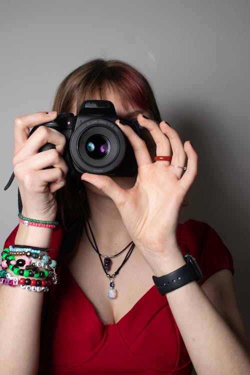 A Woman Using a Camera 