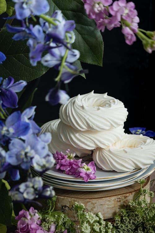 Meringues Surrounded by Flowers