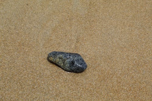 Free Stone on Sand Stock Photo