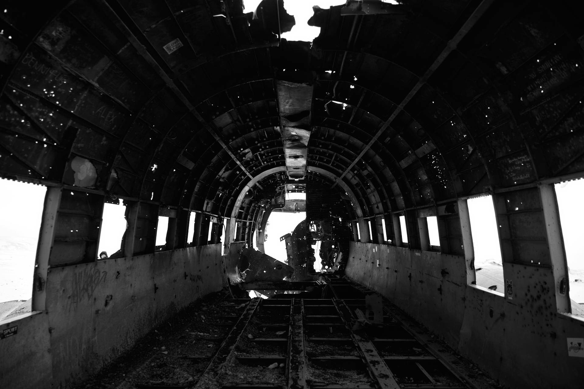 Black and white photo of abandoned plane wreckage in Iceland.