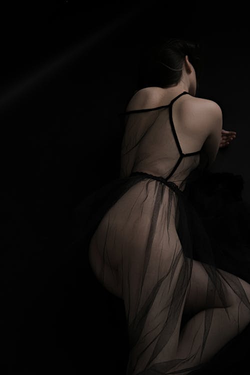 Back View Shot of a Woman Wearing Black Soft Tulle Dress 