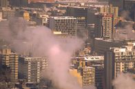 White Smoke Coming from City Buildings