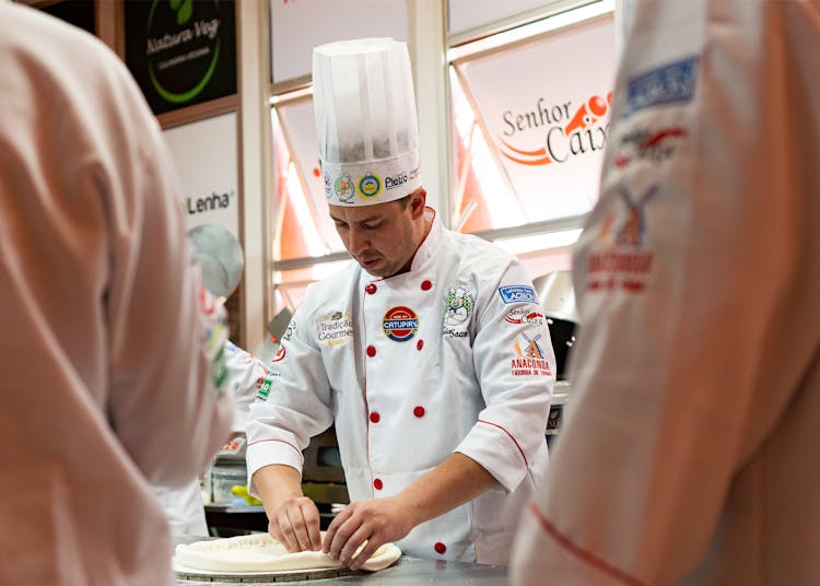 Chef Preparing Pizza At Exhibition