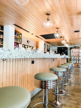 Modern bar in Miami featuring stylish seating and a polished design.