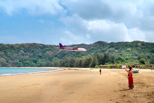 Airplane flying over Beach