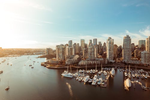 Free Drone landscape view from downtown Vancouver and boat peer during golden sunset Stock Photo