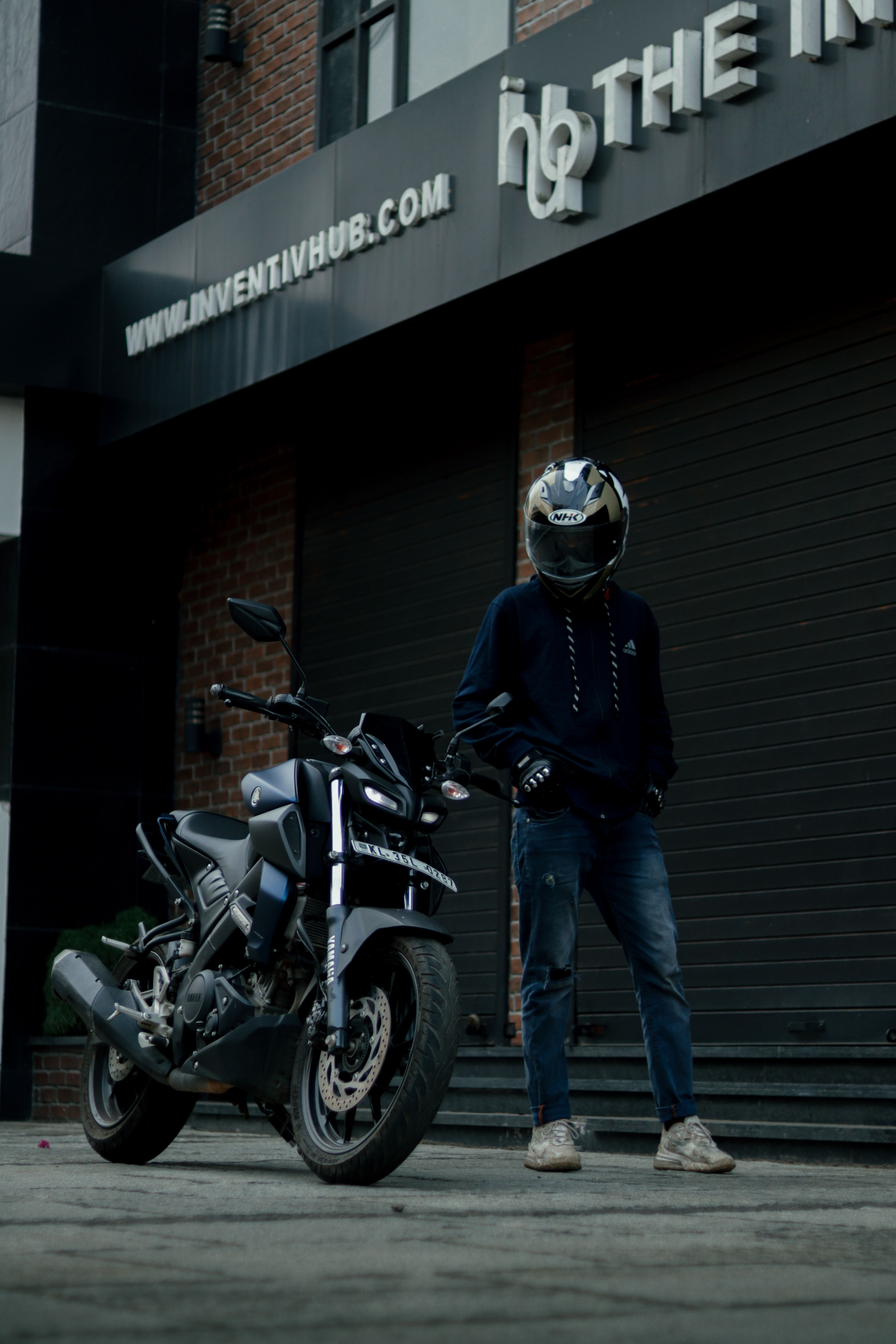 Rider standing beside a Sports Bike · Free Stock Photo