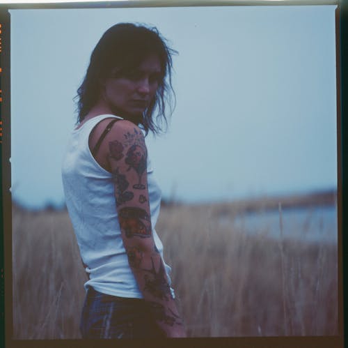 A Woman with Arm Tattoo