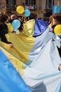 Group of People Holding Ukrainian Flag